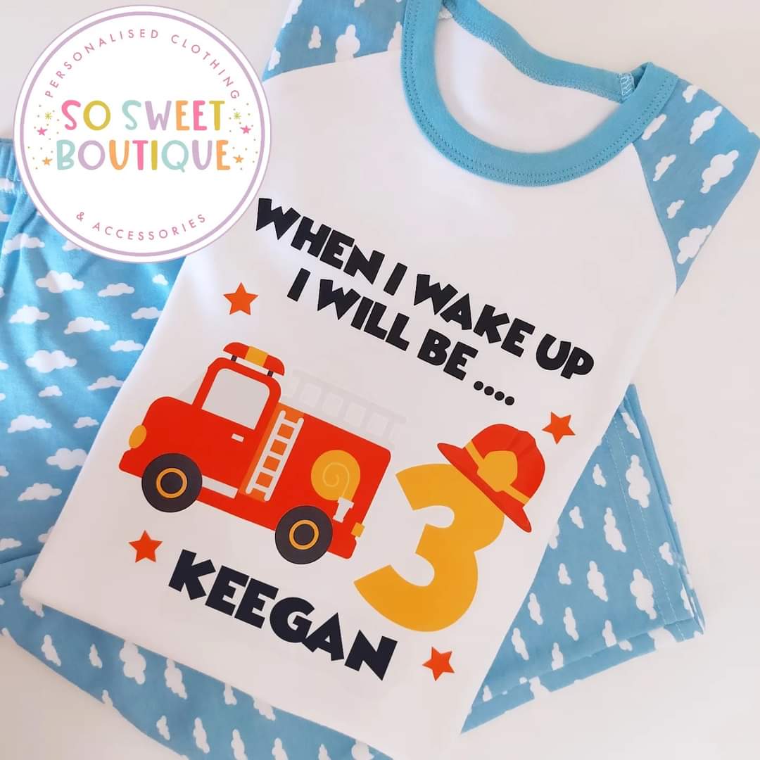 Personalized fire truck birthday pajamas for kids, featuring colorful fire truck design on soft fabric, ideal for a birthday morning.