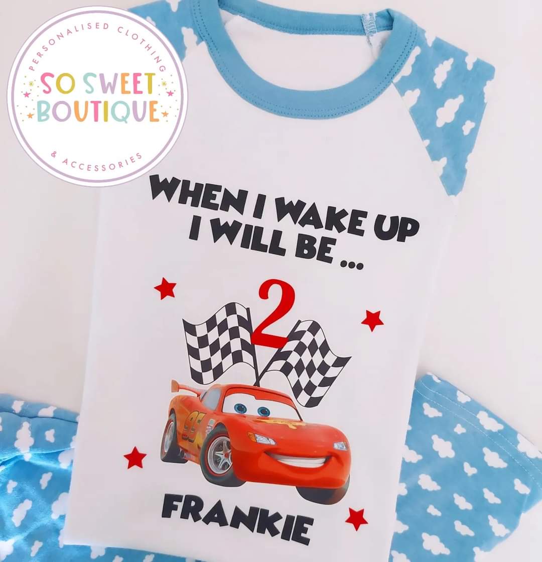 Personalized Lightning McQueen birthday pajamas for kids from SoSweetBoutiqueLtd, featuring colorful race car design and fun print.