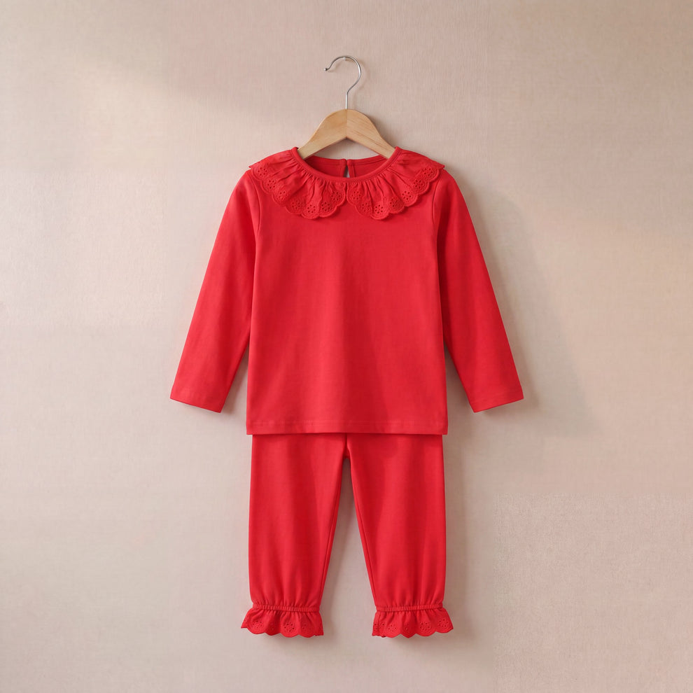 Red frilled personalised pyjamas for children by SoSweetBoutiqueLtd, featuring a cozy long-sleeve set with decorative frills.