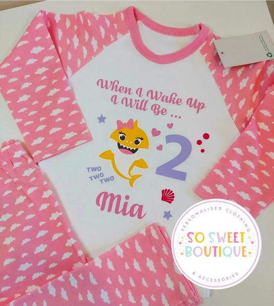 Baby Shark themed birthday pyjamas for kids, personalized sleepwear by SoSweetBoutiqueLtd featuring colorful shark and birthday designs.