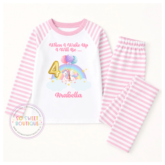 Personalised unicorn birthday pyjamas featuring colorful graphics and "When I Wake Up" text, designed for a child's special celebration.