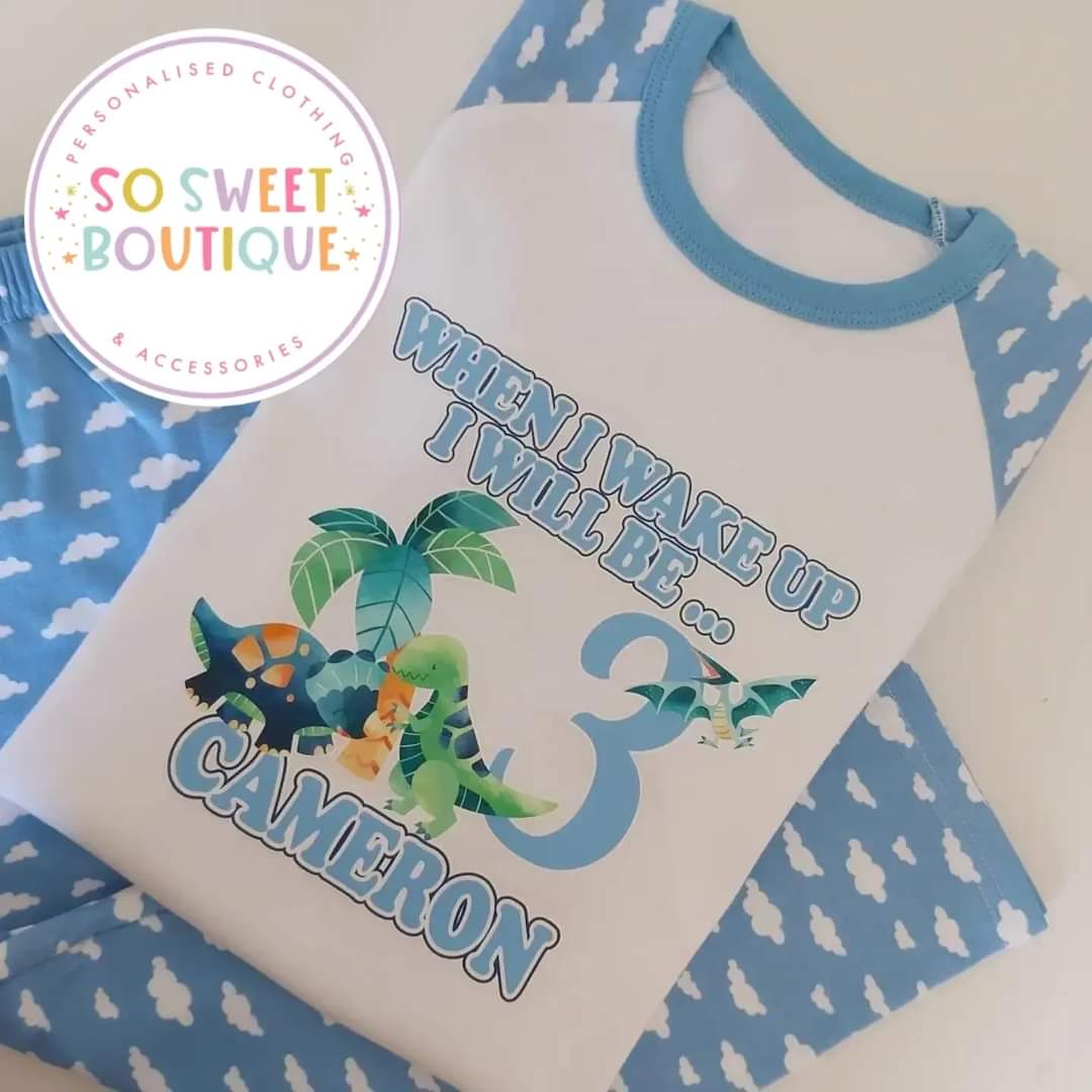 Personalised dinosaur birthday pyjamas for kids with colorful dinosaur illustrations, comfortable cotton fabric, and custom name option.