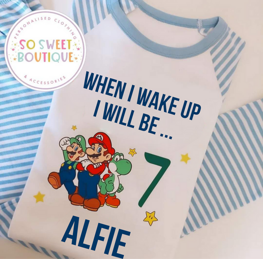 Super Mario themed personalized birthday pyjamas featuring colorful Mario graphics and custom name, perfect for a fun celebration.