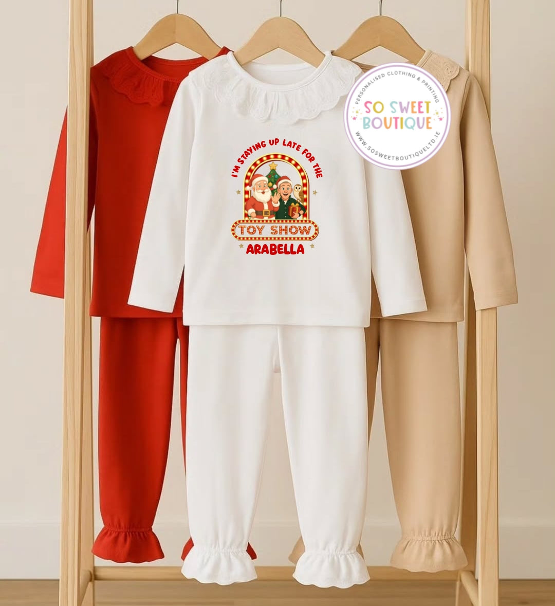White frilled personalized pajamas from The Toy Show collection by SoSweetBoutiqueLtd, featuring soft fabric and decorative frills.