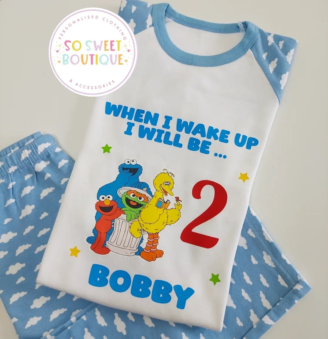 Personalized Sesame Street birthday pajamas featuring colorful characters, soft fabric, and customizable name for kids.