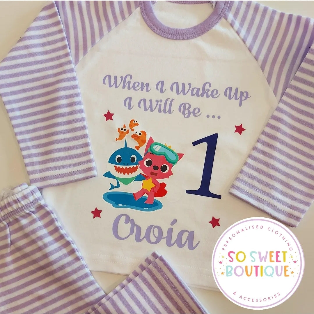 Baby Shark personalised birthday pyjamas for kids, featuring colorful shark designs and soft fabric, from SoSweetBoutiqueLtd.