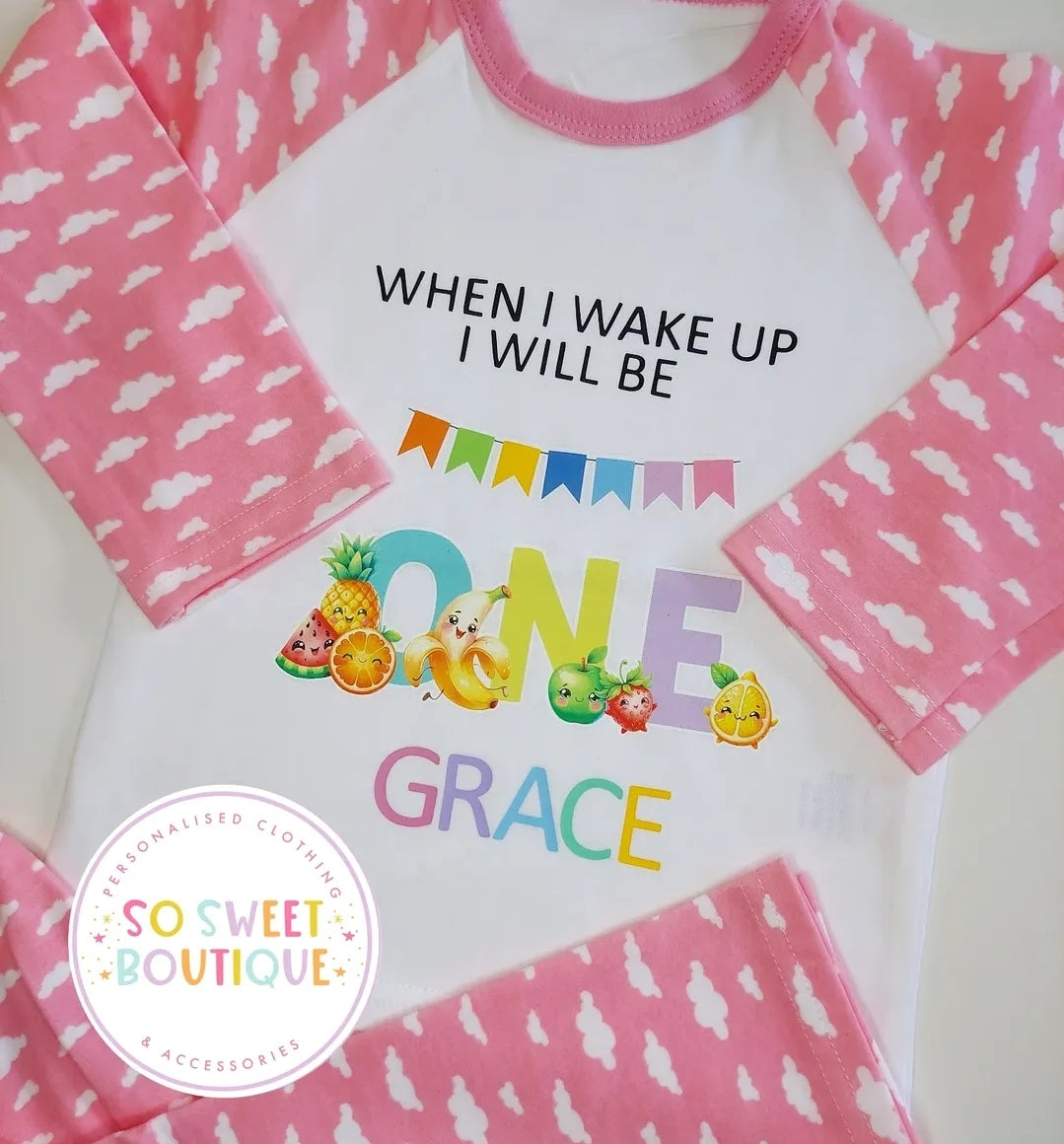 Colorful Dancing Fruits personalized 1st birthday pyjamas for babies, featuring playful fruit designs and soft fabric.