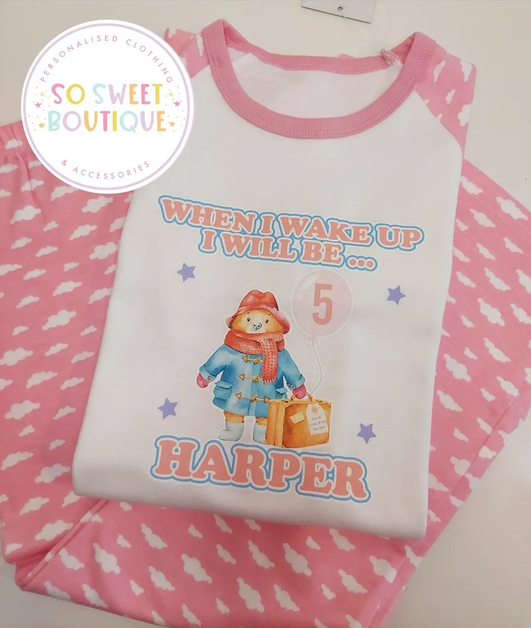 Personalised Paddington Bear birthday pyjamas for kids with colorful Paddington Bear design and playful text, made by SoSweetBoutiqueLtd.