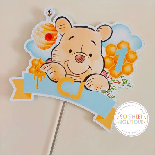 Personalized Winnie the Pooh birthday cake topper by SoSweetBoutiqueLtd featuring Winnie the Pooh figure and decorative elements.